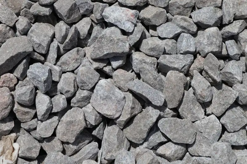 Sharp angular crushed stone, the harder interlocking aggregate specified for resin driveways on Swindon HMOs