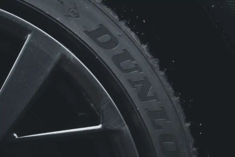 Car tyre on a driveway surface