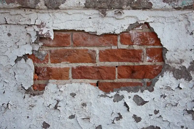 Stepped cracking in a brick wall from ground movement