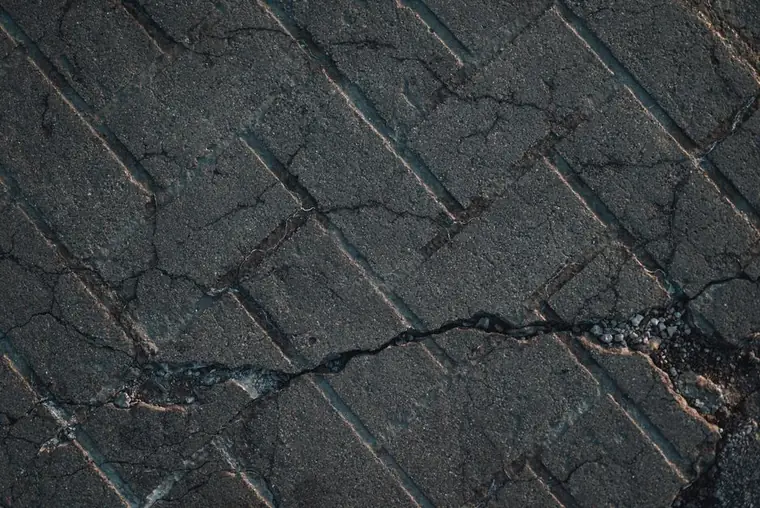 Close view of a cracked hard surface of the kind a patch repair addresses on a Swindon driveway