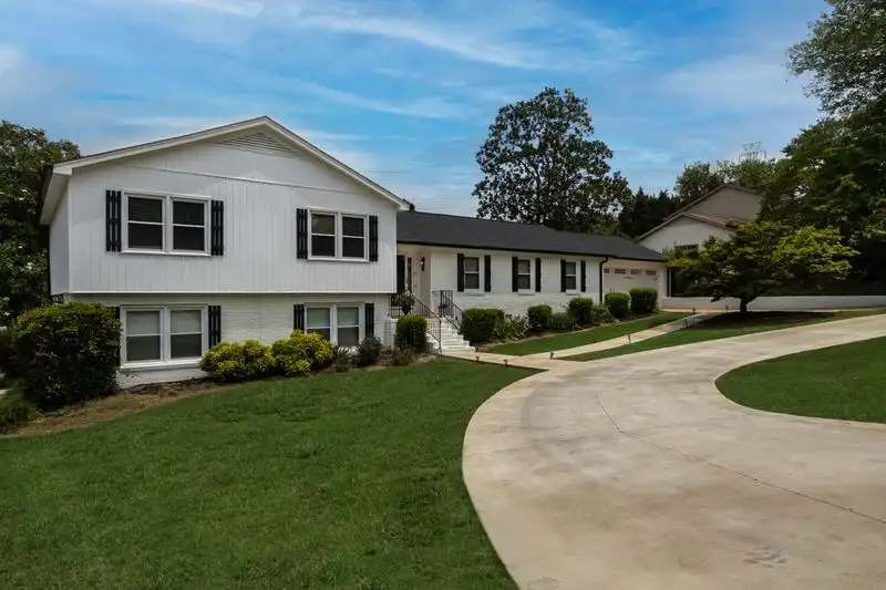 Curved driveway with landscaping and planting