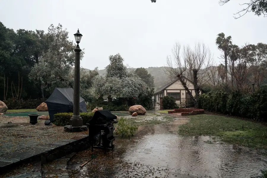 Rain water draining through a permeable driveway surface