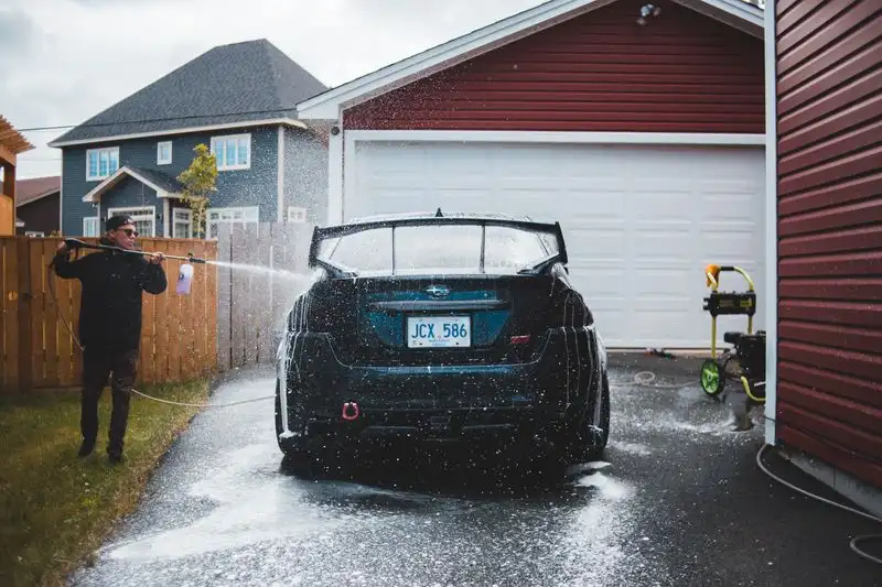 Pressure washing and cleaning a driveway surface