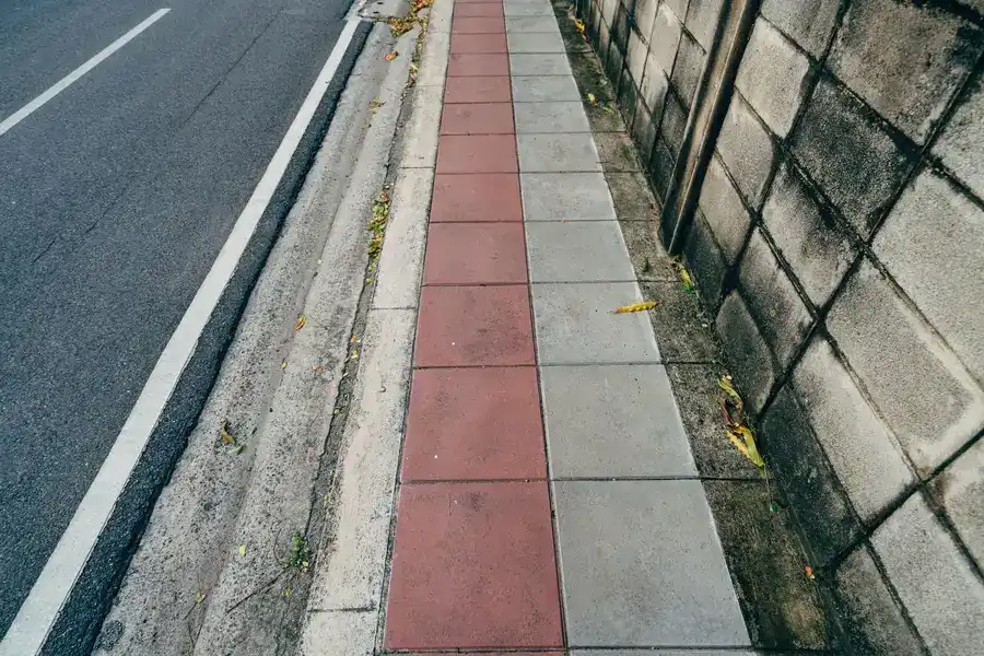 Residential street kerb showing vehicle access point onto the pavement