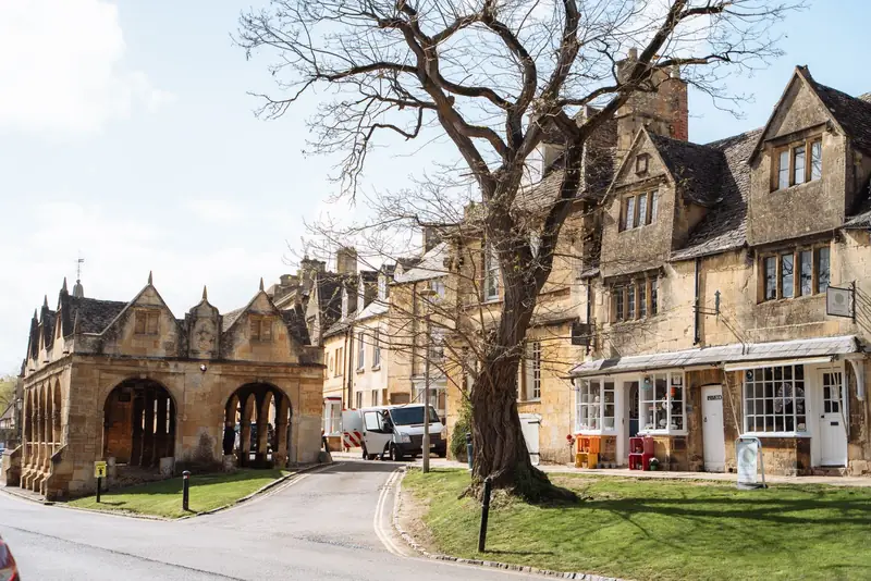 Honey-coloured Cotswold stone buildings and a market hall, the stone tone resin driveway colours are matched to around Cirencester