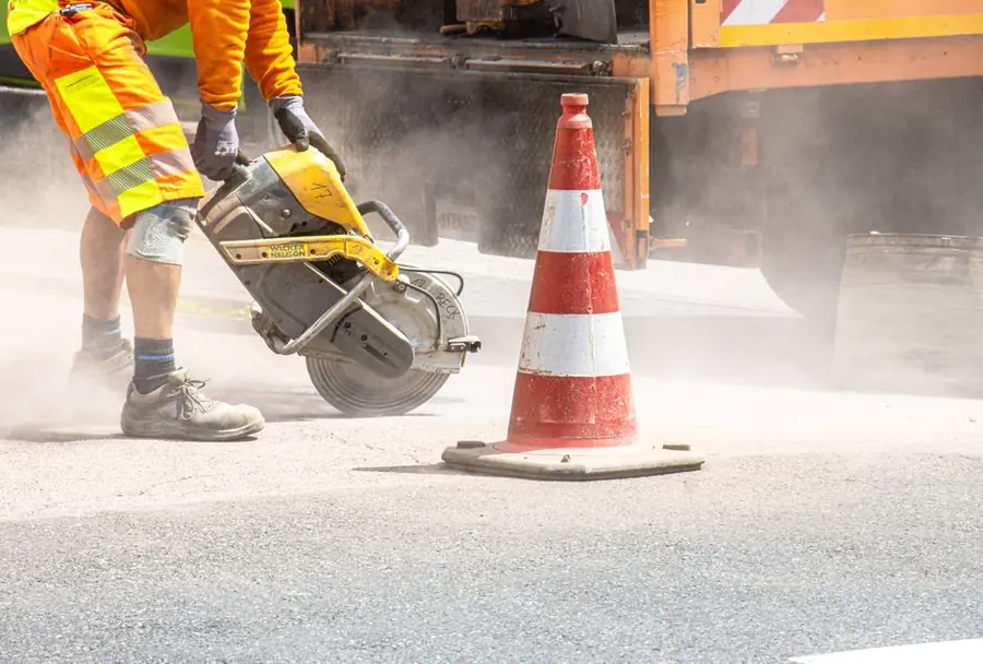 Licensed highway contractor cutting a footway to form a vehicle crossing