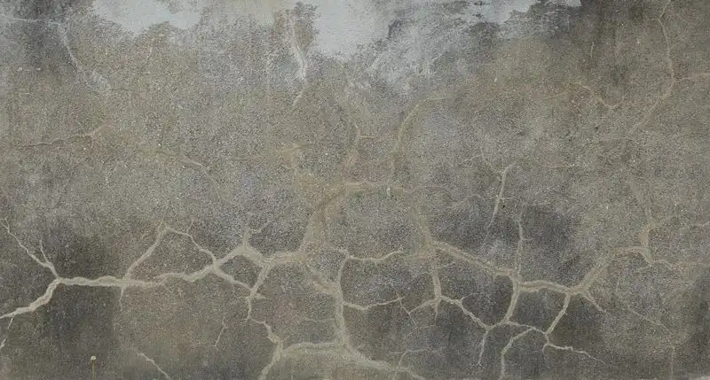 Old cracked concrete driveway surface
