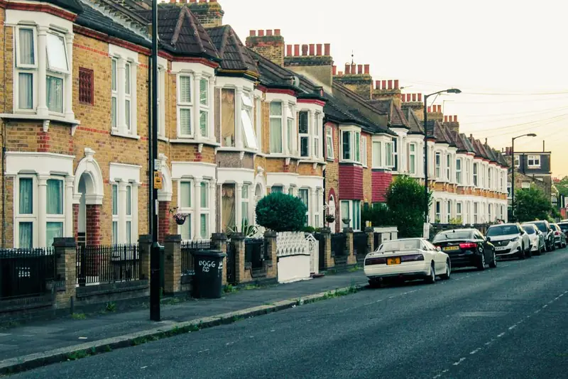 Cars parked along a British terraced street where off-street access is tight and shared