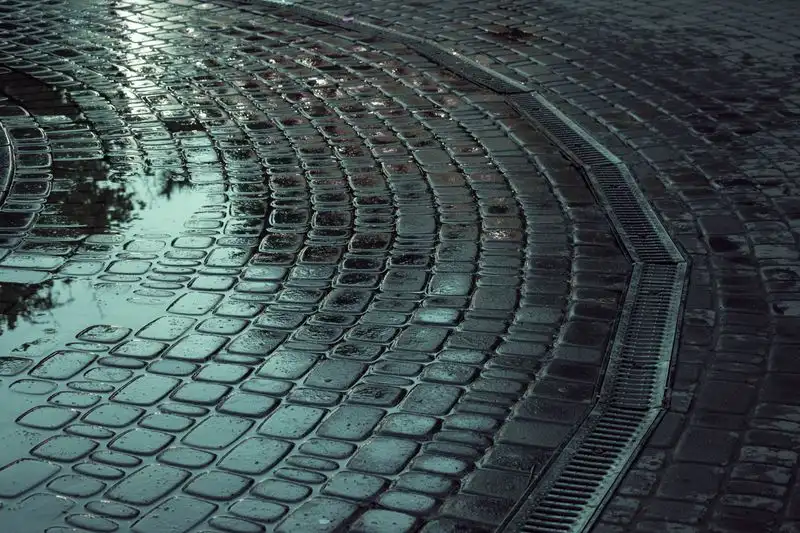 Standing water pooling on a driveway