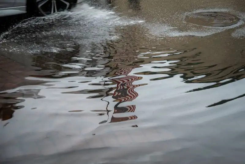 Rainwater draining on a driveway surface