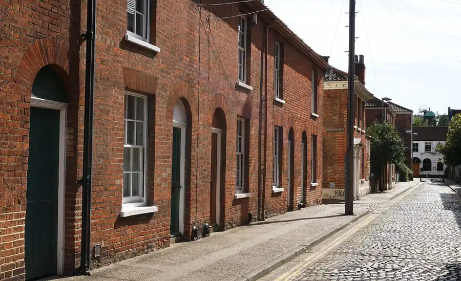 Red brick terrace with sash windows on a narrow street, similar to the older houses on Kingsbury Street in Marlborough