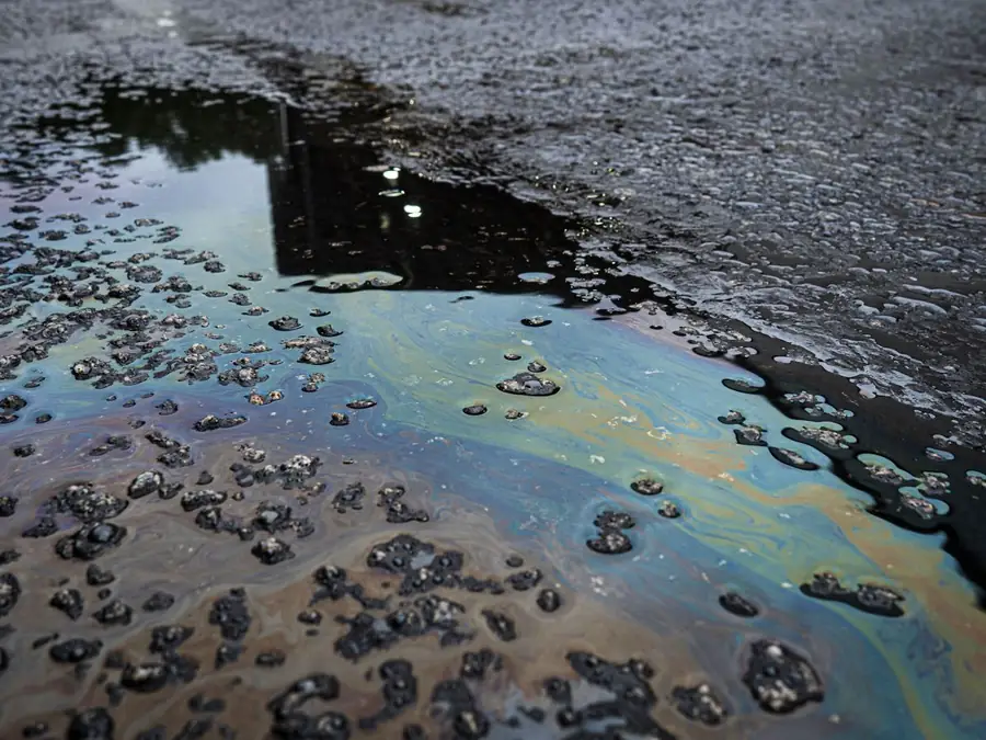 Oil and chemical spill on driveway surface