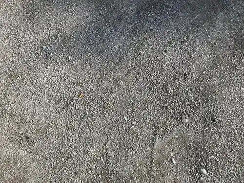 Driveway groundwork showing aggregate sub-base preparation before resin is laid