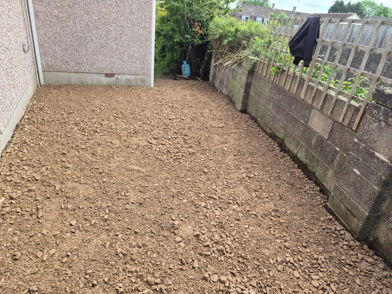 Excavated and levelled sub-base ready for a resin bound driveway installation in Swindon