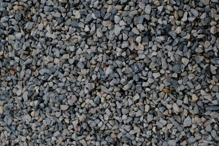Crushed stone sub-base being laid for a resin driveway