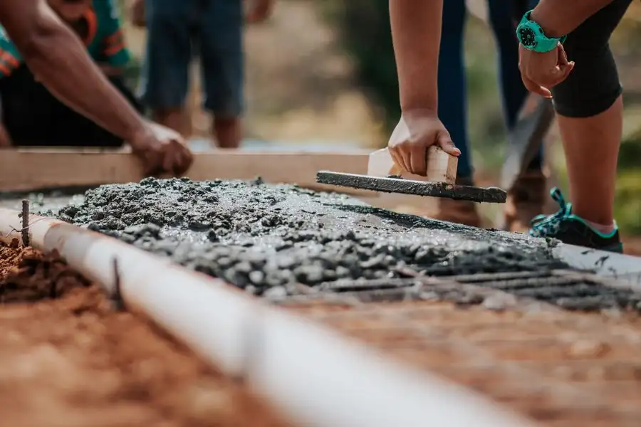 Resin surface being laid and trowelled by hand