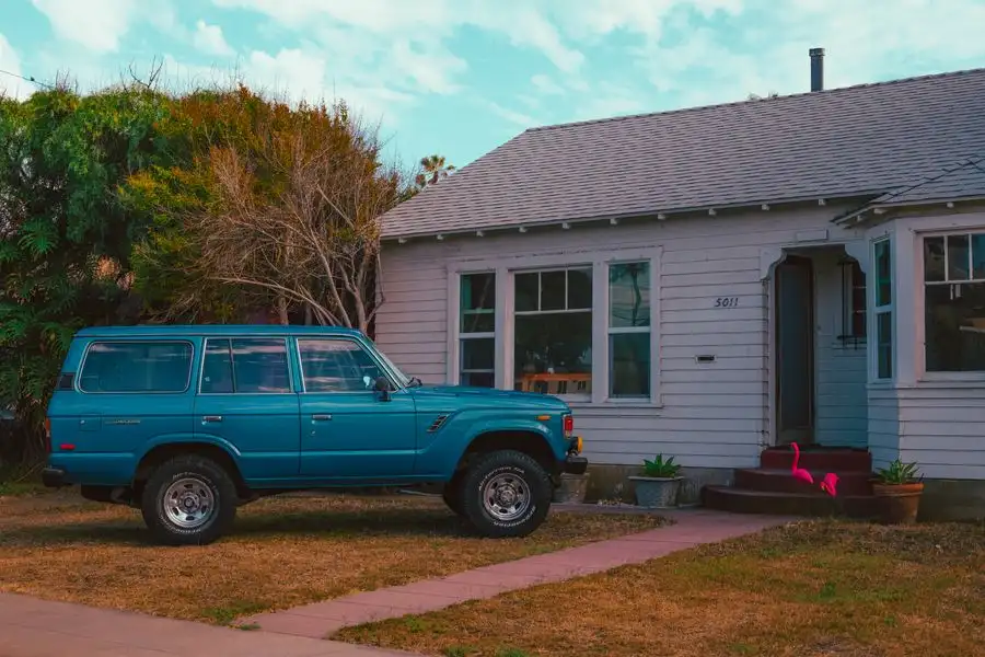 SUV parked on a driveway outside a home