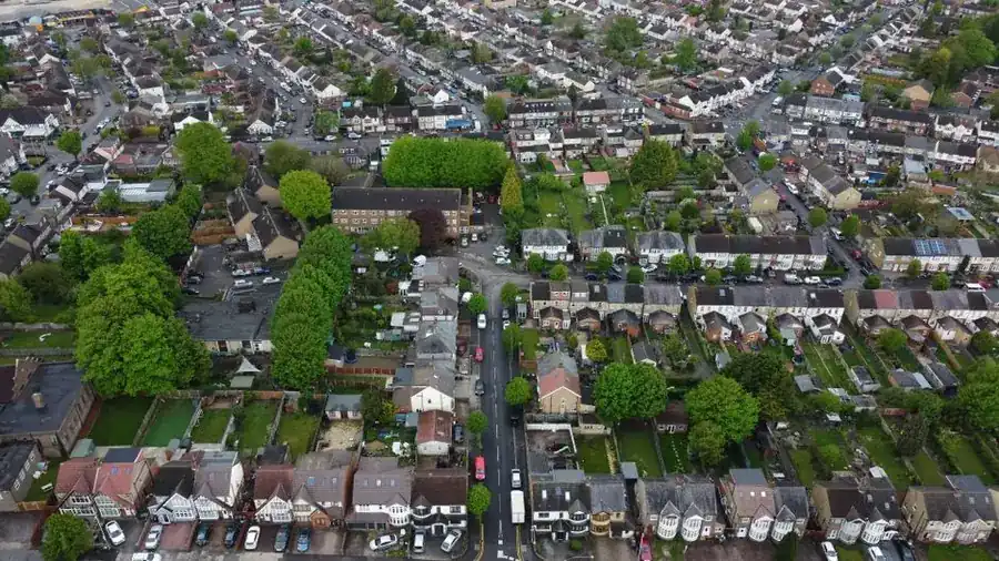 Aerial view of a British residential estate showing rooftops, gardens and frontage depths