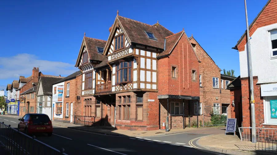 Timber-framed building on an English market town high street, similar in style to the historic frontages in Royal Wootton Bassett's conservation area