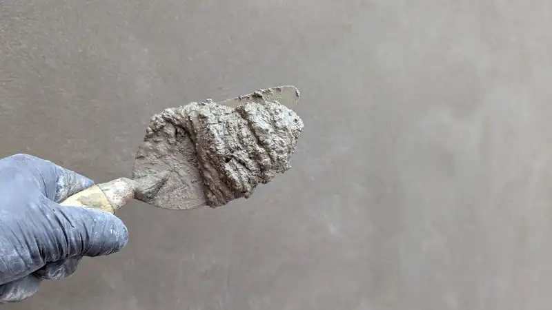Trowelling a resin surface by hand