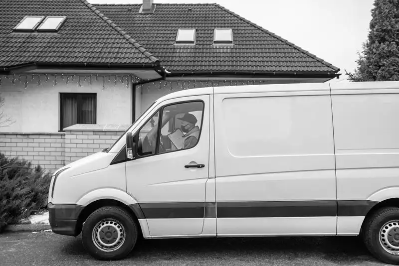 Van parked outside a house