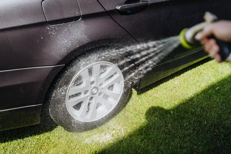 Washing a driveway with a garden hose