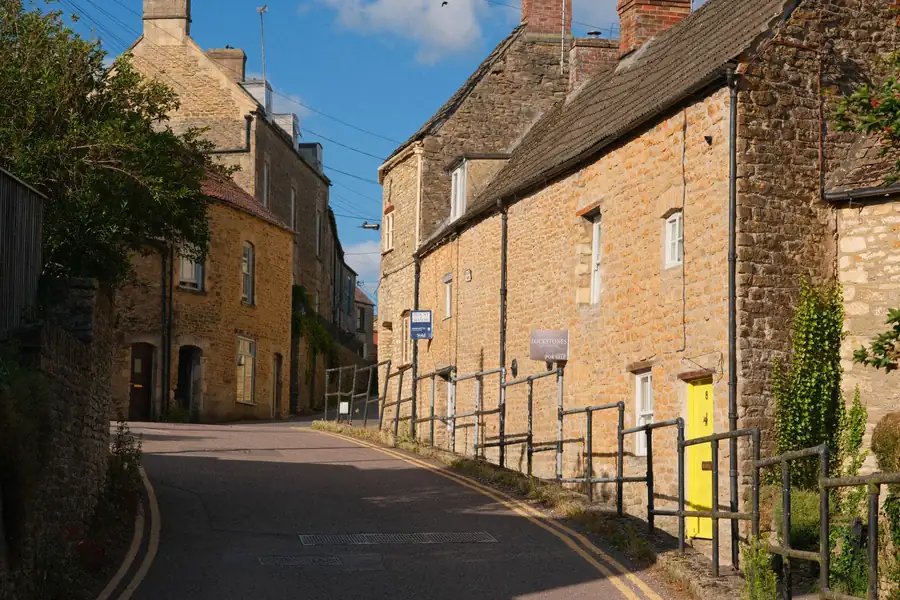 Wiltshire limestone cottages on a narrow street near Chippenham