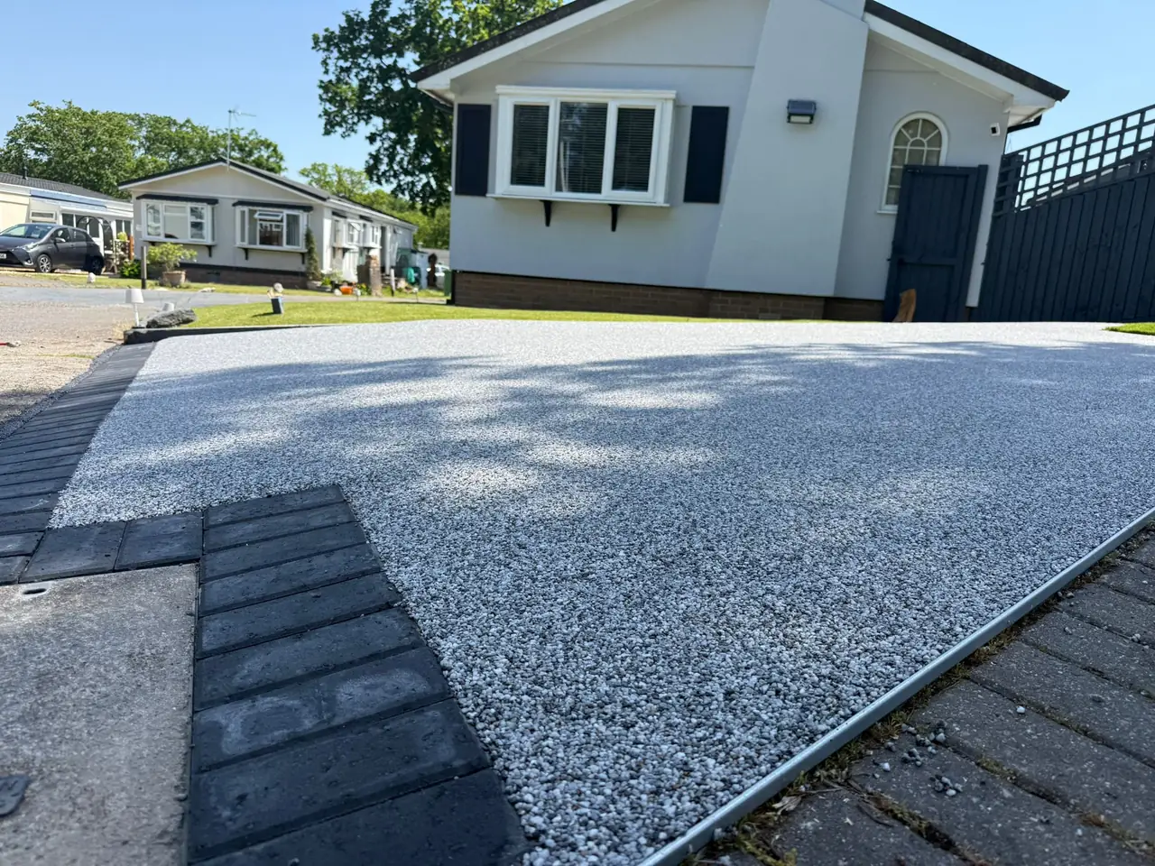 Close up of silver grey resin bound driveway finish in Swindon