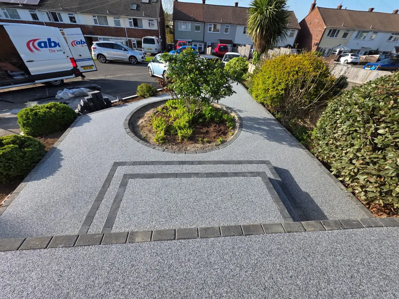 Resin pathway with circular flower bed feature in Swindon